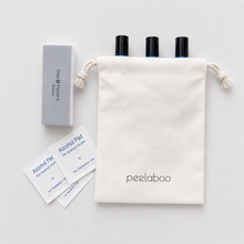 Load image into Gallery viewer, Set of peelaboo skincare products including bottles, alcohol pads, and a pouch on a light gray background.