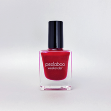 Load image into Gallery viewer, Red nail polish bottle with black cap on a white background
