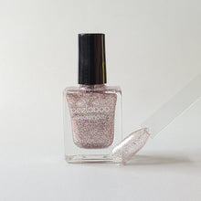 Load image into Gallery viewer, peelable water-based 'Glam' polish bottle with colored sample nail
