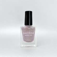 Load image into Gallery viewer, Nail polish bottle with glittery pink and silver color and black cap on a light gray background
