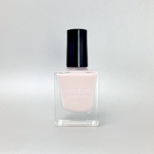 Load image into Gallery viewer, Light pale pink Nail polish bottle with a black cap on a light gray background
