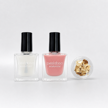 Load image into Gallery viewer, Peelaboo Sheer Blush Gold Kit — base coat, Semi-bloom pink nail polish, and gold foil tin
