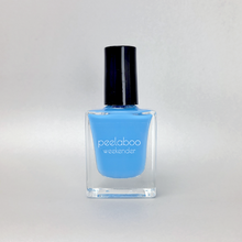 Load image into Gallery viewer, Sky Blue nail polish bottle with black cap on a light gray background
