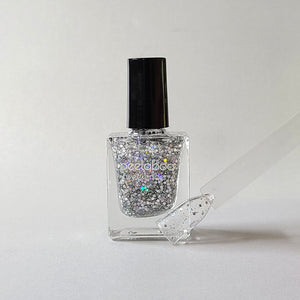 peelable water-based 'Bling' polish bottle with colored sample nail